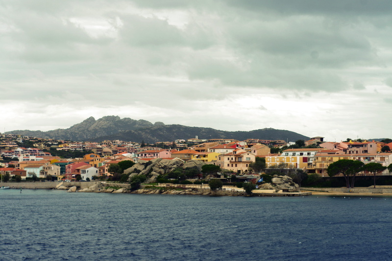 land, sardinia, building exterior, outdoors, architecture, mountain, residential district, city, beach, cloud - sky, italy, seaside, sardinia, no people