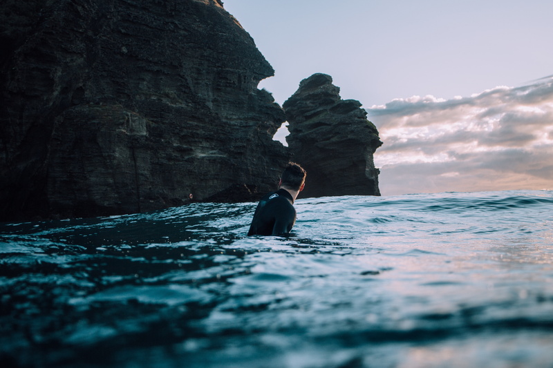 waterfront, sky, lifestyles, surfers, rock, solid, adventure, 4K, water, one person, formation, nature, sport, surfing, nautical vessel, sea, beauty in nature