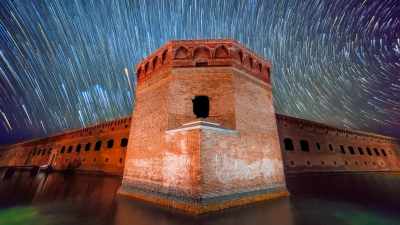 scenics - nature, starry night, water, astronomy, nature, starry, no people, 4K, the past, long exposure, building, history, architecture, night, star trails