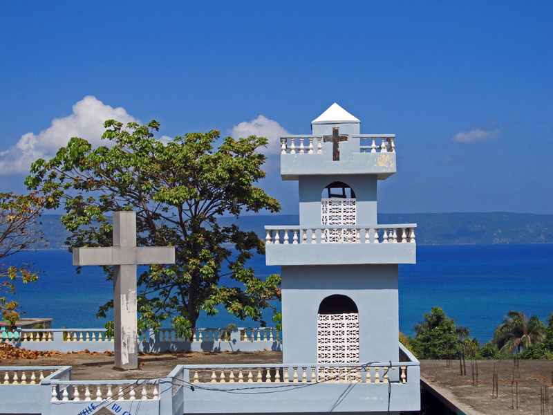 building, blue sea, no people, blue sky, sea, tower, water, colorful, spirituality, built structure, blue, outdoors, tortuga, caribbean, sky, haitian, direction