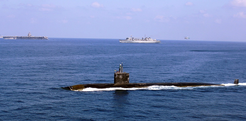 building exterior, horizon over water, built structure, travel, vehicle, outdoors, sky, submarine, mode of transportation, tower, lighthouse, ship, no people