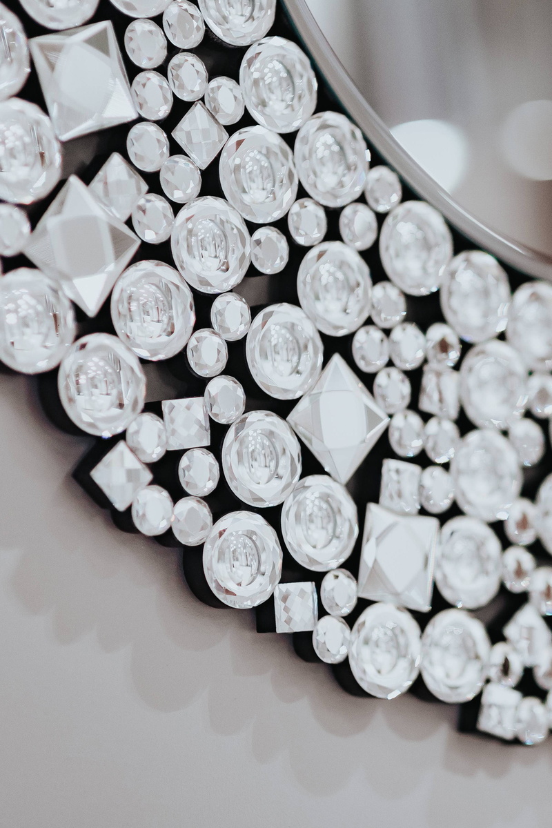 large group of objects, 2K, crystal, circle, arrangement, high angle view, indoors, adorned, round, reflection, shape, shiny, close-up, metal, business