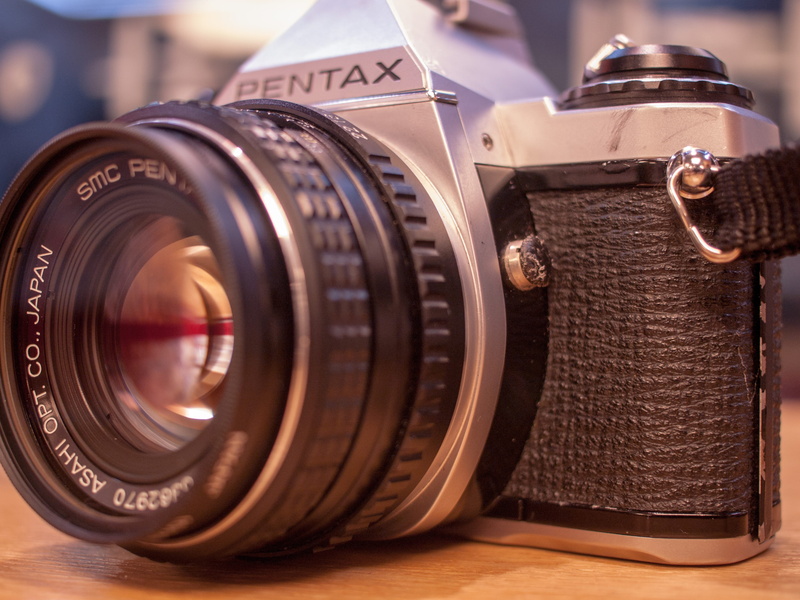 focus on foreground, two objects, once upon a time, black color, antique, arts culture and entertainment, lens - eye, photographic equipment, film, camera