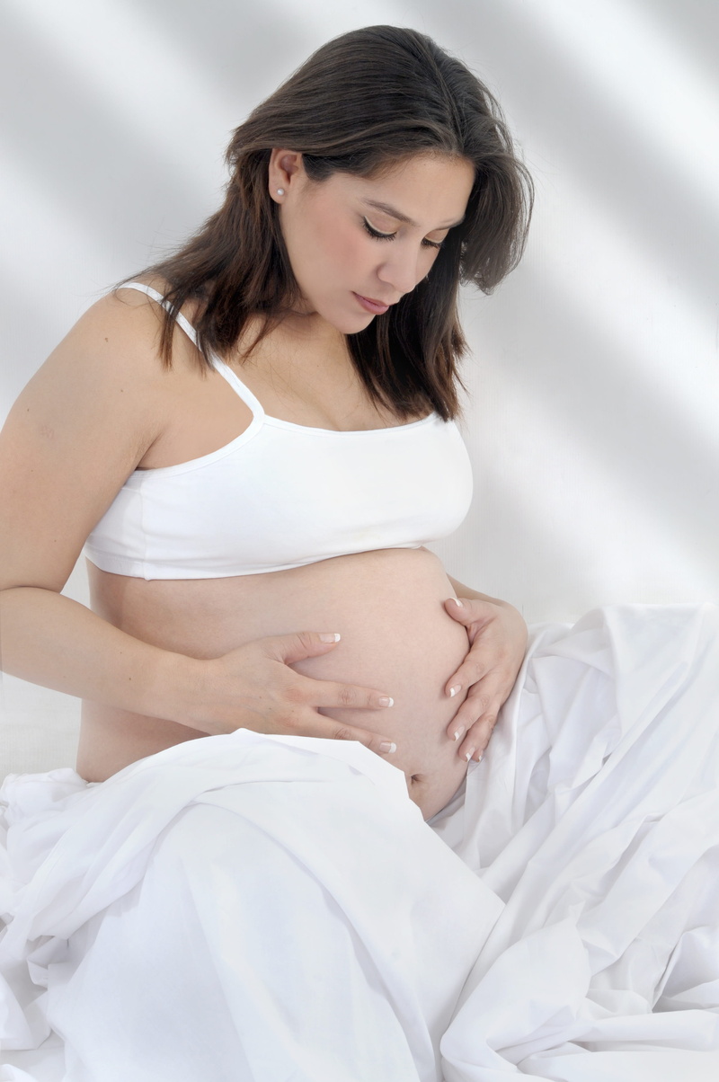 women, beginnings, human body part, pregnant, three quarter length, one person, 4K, front view, hair, mama, looking, furniture, hands on stomach, panza