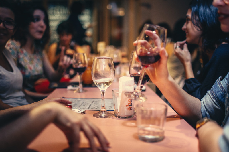 blurred background, table, table setting, women, drinking, restaurant, drink, young adult, social gathering, 4K, group, horizontal, facial expression