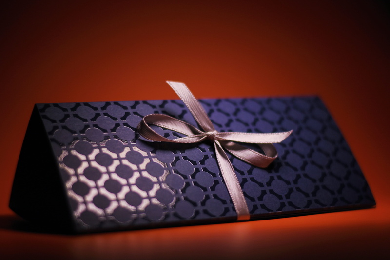 table, giftbox, birthday, studio shot, close-up, container, 4K, colored background, surprise, present, two objects, ribbon, red, metal, box, black color