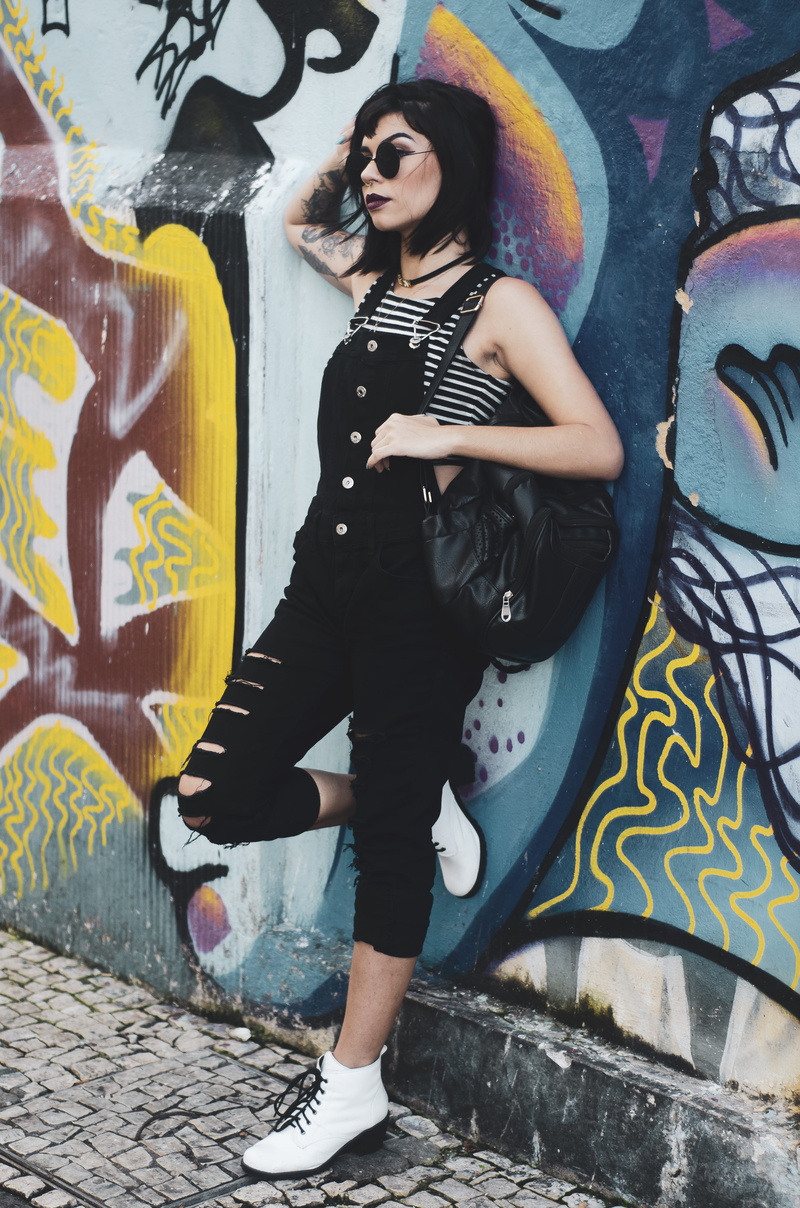 wall - building feature, creativity, full length, woman, front view, leisure activity, standing, pose, style, graffiti, fashion, photoshoot, culture, casual clothing