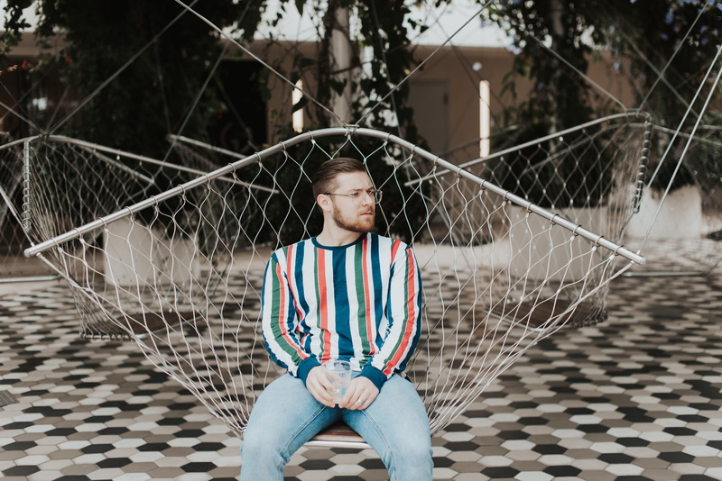 couch, real people, furniture, hammock, outdoors, focus on foreground, men, males, teenager, clothing, denim, human, playground, person, glasses, apparel