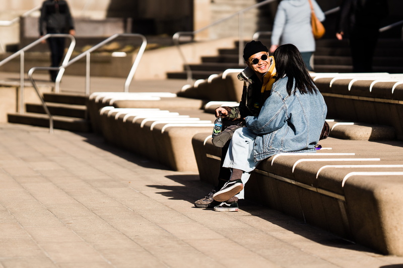 architecture, footwear, handrail, couch, casual clothing, 2K, person, human, beautiful woman, people, flagstone, real people, sleeve, man, bench, shoe