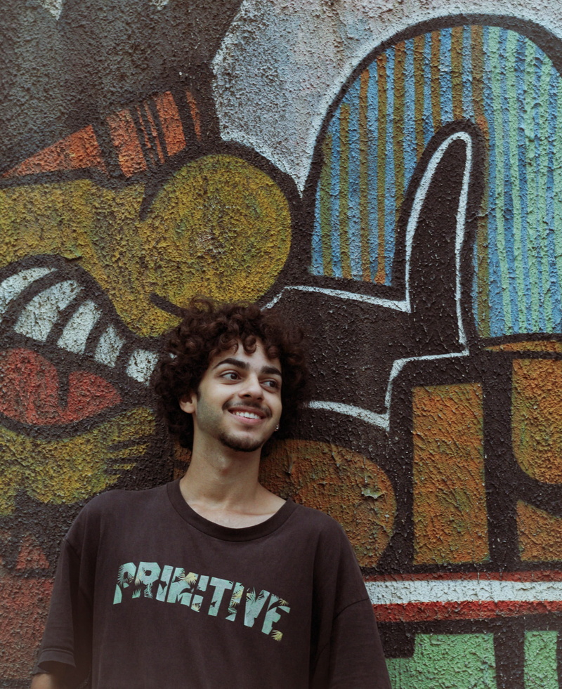 smiling, emotion, happy, wear, casual clothing, colours, facial expression, teenager, happiness, street art, portrait, adult, wall - building feature, colors