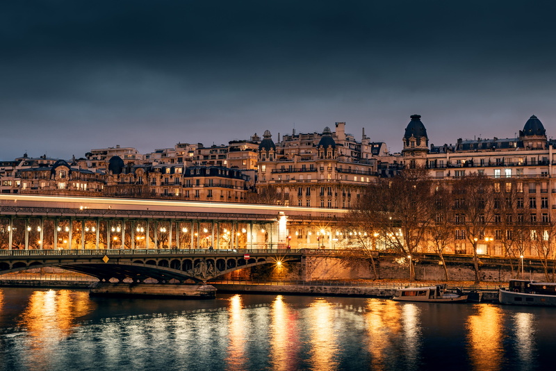 waterfront, built structure, spire, steeple, near, building exterior, metropolis, river, building, connection, arch bridge, city, bridge - man made structure
