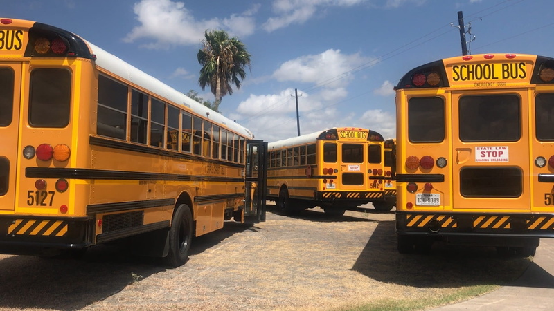 public transportation, parked, bus, travel, city, stop, nature, buses, bus stop, land vehicle, people, public, safety, sunlight, yellow, train - vehicle