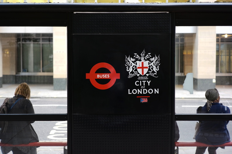 transportation, crest, street, barbican, men, back, outdoors, day, united kingdom, western script, city of london, two, emblem, 4K, glass - material, building exterior