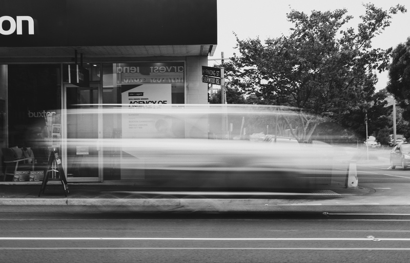outdoors, vehicle, wheel, land vehicle, advertisement, sports car, #blackandwhite #car, station, long exposure, public transportation, street, motion, train