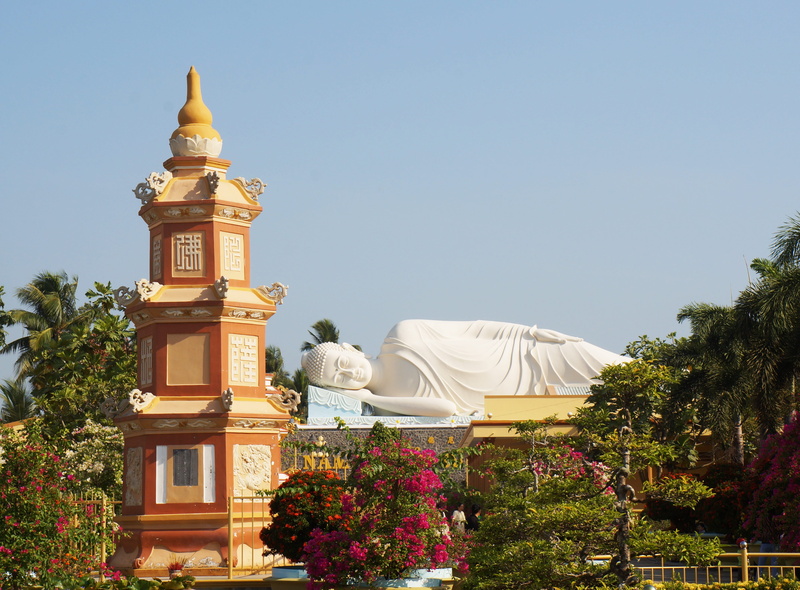 no people, building, outdoors, vinh trang pagoda, tower, spirituality, statue, building exterior, clear sky, belief, nature, sky, travel destinations, tree