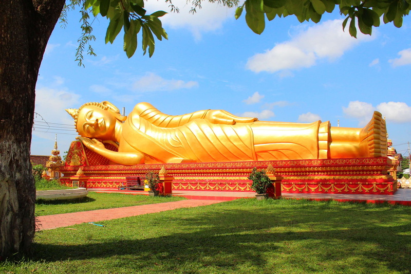 laos, temple, reclining buddha, place of worship, 2K, spirituality, sky, tree, no people, statue, built structure, religion, creativity, nature, ornate