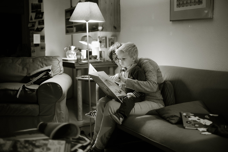 woman, white, people, relaxation, family, young adult, lifestyles, mother, adult, lamp, wear, leisure activity, studying, holding, reading, kid, furniture