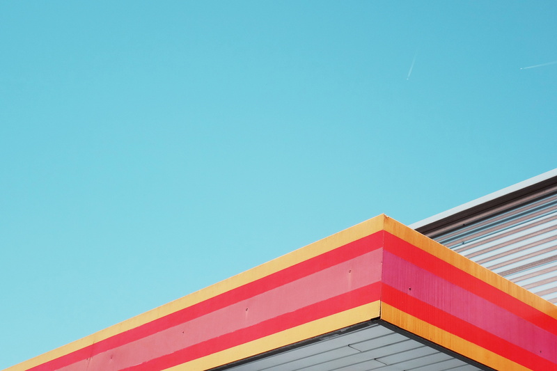 city, structure, building exterior, building, low angle view, wooden, pattern, multi colored, pink, yellow, copy space, sunlight, no people, architecture