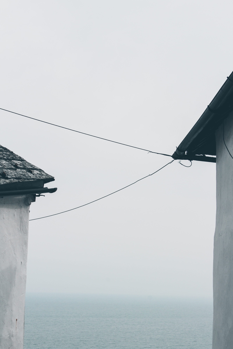 slate, clear sky, utility pole, water, roof, gutter, flying, rural, day, steeple, architecture, shelter, no people, agelaius, spire, built structure, sea