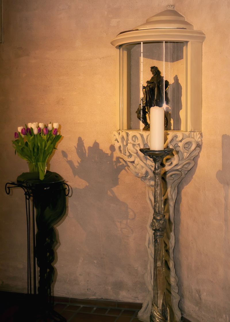 wall - building feature, jesus, flower, statue, god, vase, flame, wall, representation, indoors, nature, cross, plant, bell, priest, no people, religion