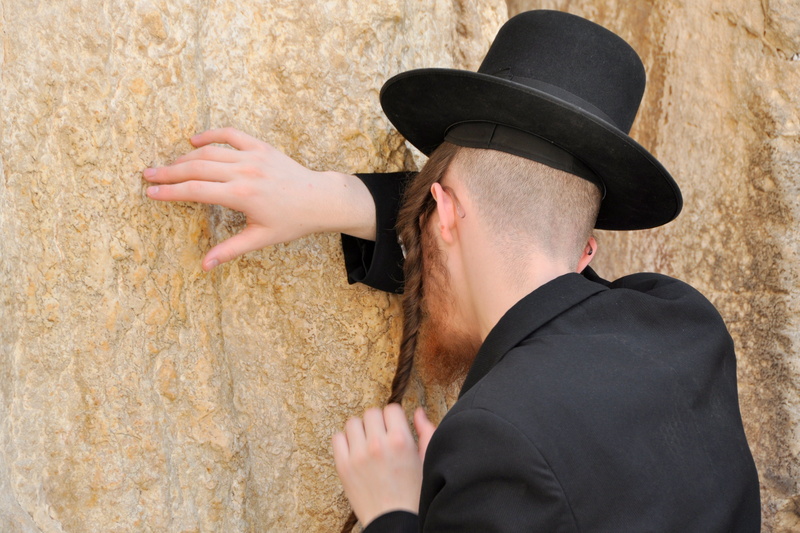 clothing, s, hat, portrait, finger, young adult, real people, pray, headshot, wall - building feature, outdoors, day, black, human body part, men, suit