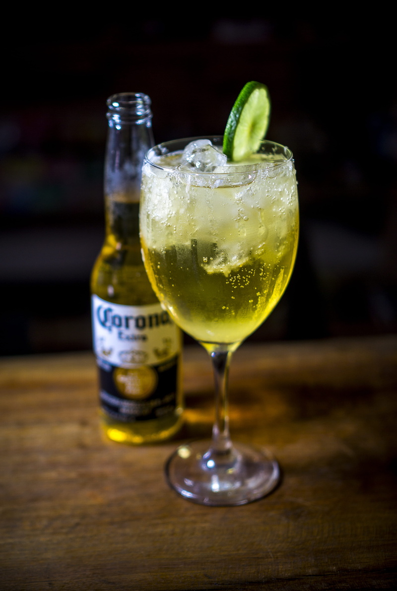 indoors, corona, citrus fruit, food and drink, focus on foreground, bar - drink establishment, freshness, household equipment, glass, filled, tequila - drink