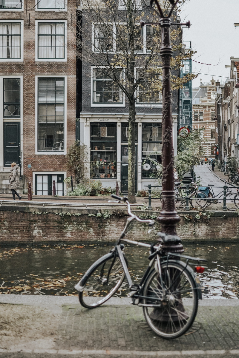 bicycle, window, day, land vehicle, no people, brick, black, person, canal, mode of transportation, architecture, building, walkway, amsterdam, building exterior