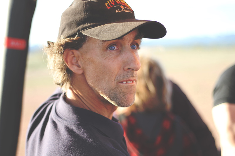 side view, cap, focus on foreground, man, one person, phoenix, clothing, blue eyes, sky, beard, real people, contemplation, leisure activity, day, young men