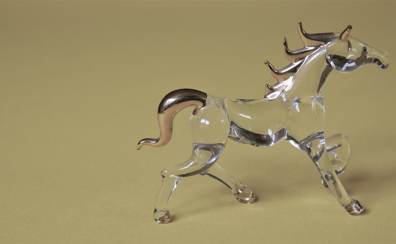 indoors, studio shot, spilling, quadruped, hoof, sculpture, drink, close-up, colored background, food and drink, figure, tail, fantasy picture, horse mane