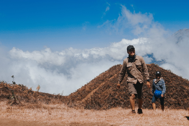 mountain, standing, 2K, man upon the hill, nature, beauty in nature, activity, cloud - sky, mountaineering, shorts, soil, people, lifestyles, day, dieng
