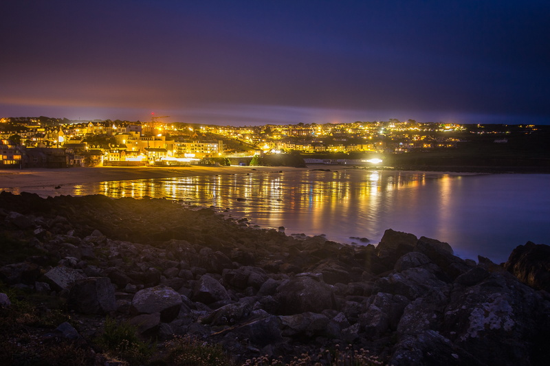 architecture, city, dawn, distance, st ives, ocean, town, sea, england, built structure, sky, building, body, water, land, illuminated, near, no people