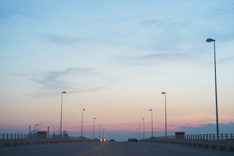 sunset, motor vehicle, built structure, outdoors, negativespace, clean, architecture, street light, citydriving, city, no people, sky, bridge - man made structure