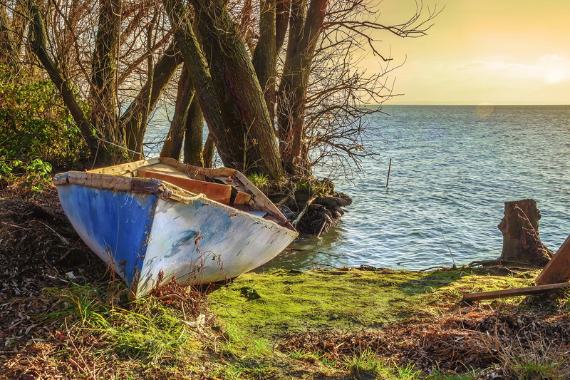 outdoors, white, waterfront, hungarian sea, transportation, jon, water, tranquil scene, boat, obsolete, beach, lake, sky, rowboat, land, scenics - nature