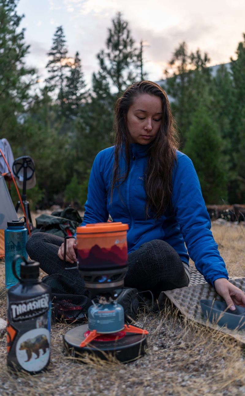 ground, mat, beside, gas, camping, outdoors, women, nature, long hair, walk, stove, young adult, warm clothing, land, wood, camp cooking, wild, outdoor