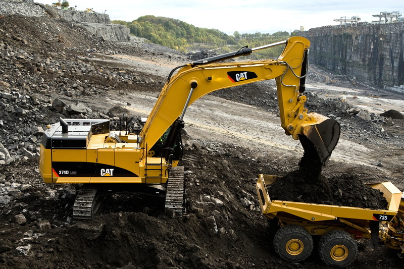 transportation, quarry, construction equipment, earth mover, mode of transportation, construction industry, road, nature, day, construction vehicle, yellow