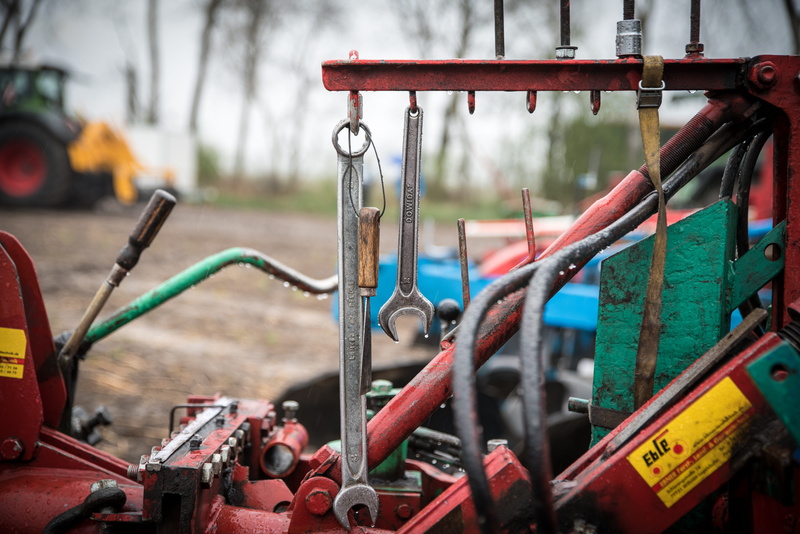 digging around, focus on foreground, agricultural machine, control, mode of transportation, machine part, tractor, no people, travel, nature, symmetry