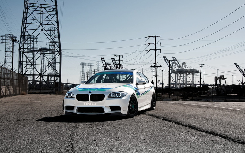 architecture, power lines, land vehicle, front view, sky, light, power supply, outdoors, power line, transportation, technology, car, white, motor vehicle