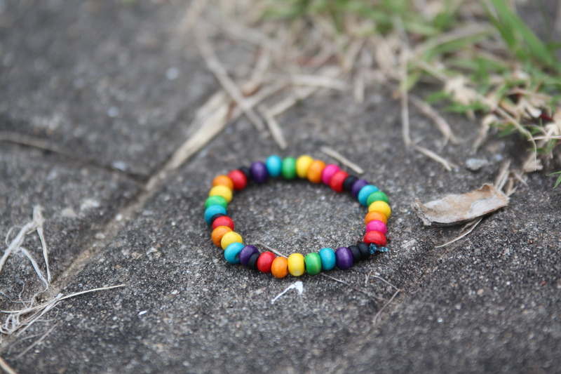 pavement, personal accessory, accessories, girl, selective focus, gray, circle, shape, multi colored, multicolored, photo, still life, 2K, focus, jewelry