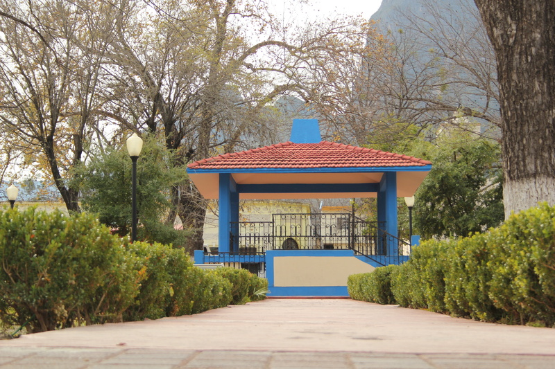 building exterior, park, tourism, sky, latin america, park - man made space, building, bench, town, green color, plaza, gazebo, no people, direction, built structure