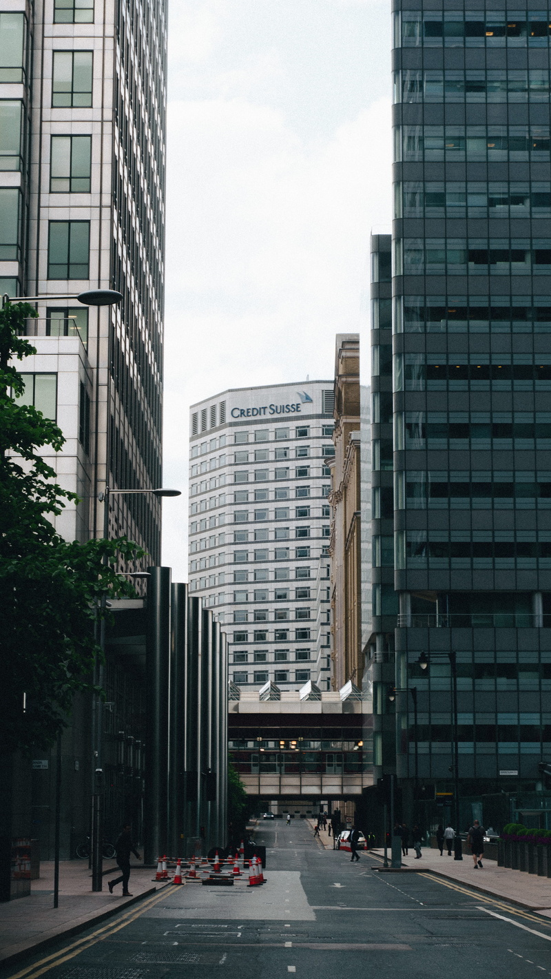 trees, nature, credit suisse, office building exterior, grey clouds, city, motor vehicle, no people, tall - high, day, financial district, modern, transportation