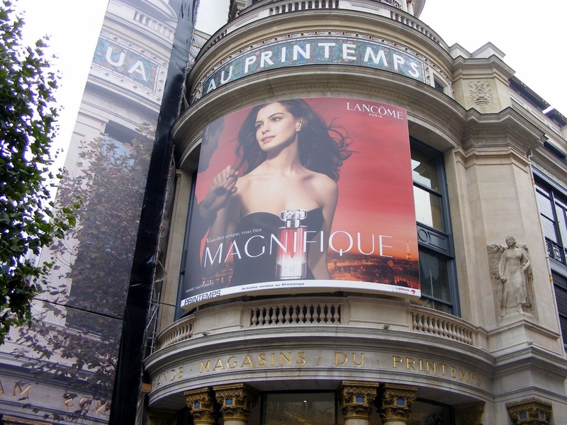 western script, models, representation, low angle view, city, poster, text, paris, advertise, female likeness, sculpture, nature, communication, summer