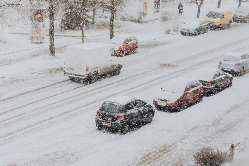 tree, land vehicle, motor vehicle, town, field, street, cars, covering, no people, land, nature, snow, outdoors, car, road, white color, day, winter, transportation