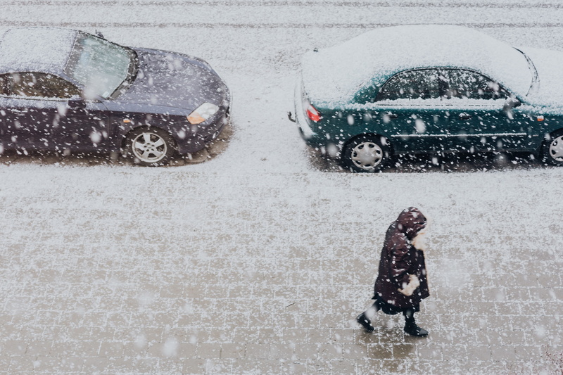 cars, transportation, high angle view, snowing, child, extreme weather, outdoors, rainy season, cold temperature, mode of transportation, town, winter