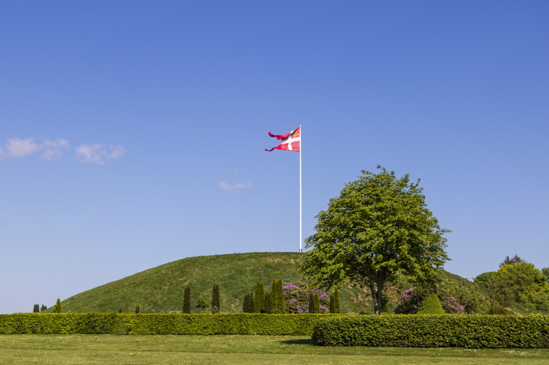 gorm and thyra, sky, green color, grass, growth, architecture, land, tree, nature, clear sky, patriotism, no people, blue sky, history, flag, mound, built structure