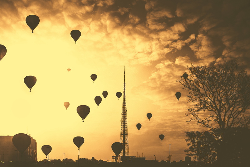 architecture, mid-air, sky, silhouette, transportation, air vehicle, hot air balloon, contrast, no people, beauty in nature, trees, building exterior, hot air balloons