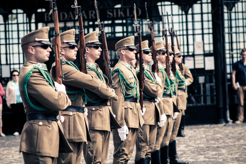 protection, outdoors, europe, array, real people, side by side, human, holding, sunlight, city, troop, focus on foreground, military, culture, marching