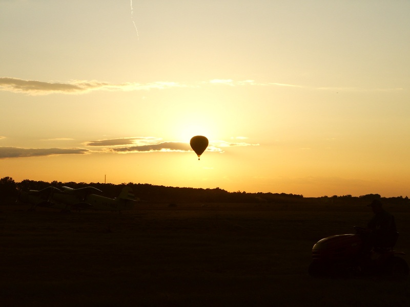 nevsehir, air vehicle, beauty in nature, leisure, field, mid-air, sunset, hot Air Balloon, flying, travel, sky, adventure, environment, land, silhouette
