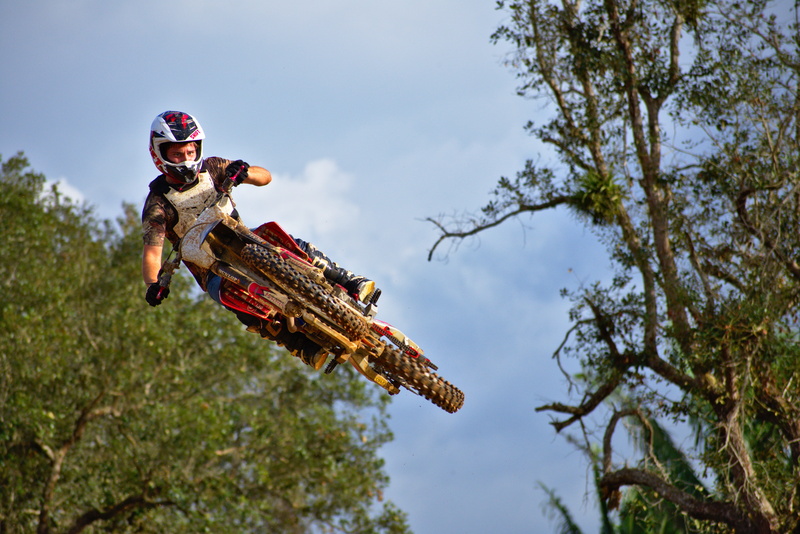 nature, whip, airborne, jump, outdoors, tree, redneck, sports helmet, full length, adult, fun, action, plant, skill, muddy, wood, sky, activity, outdoorsman