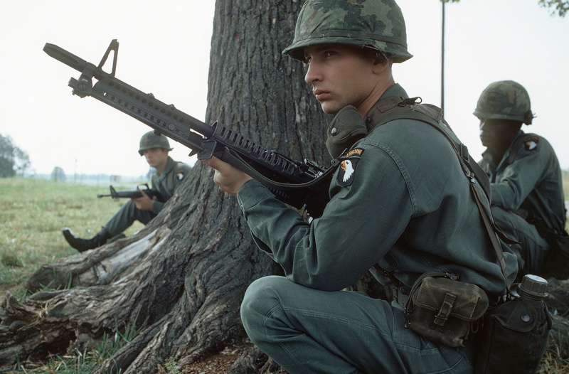 three quarter length, government, land, assault, vietnam, outdoors, gun, airborne, holding, real people, young men, young adult, soldier, people, War and Army
