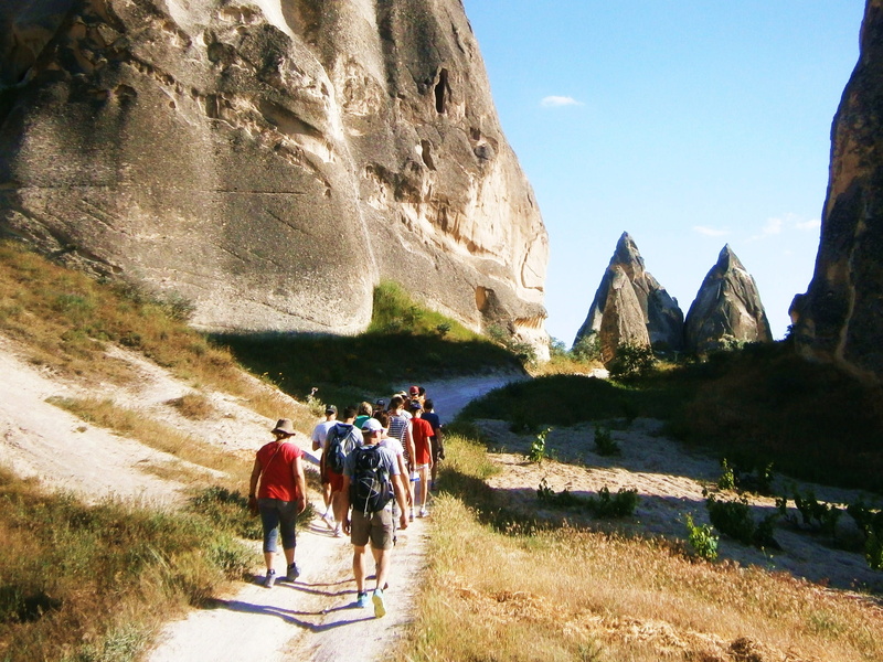 water, adult, sunlight, walking, beauty in nature, women, rear view, real people, tuff rock, nature, outdoors, 2K, group of people, sky, men, leisure activity